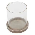 Close view from above of the lantern's open clear sleeve, showing the round interior and pale weathered edging of the base.