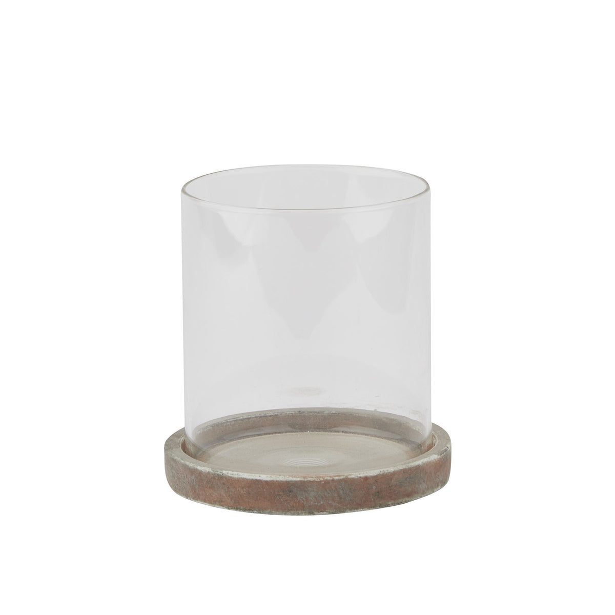 Candle lantern with a clear open cylindrical sleeve seated in a shallow mottled brown and grey base, shown against white.
