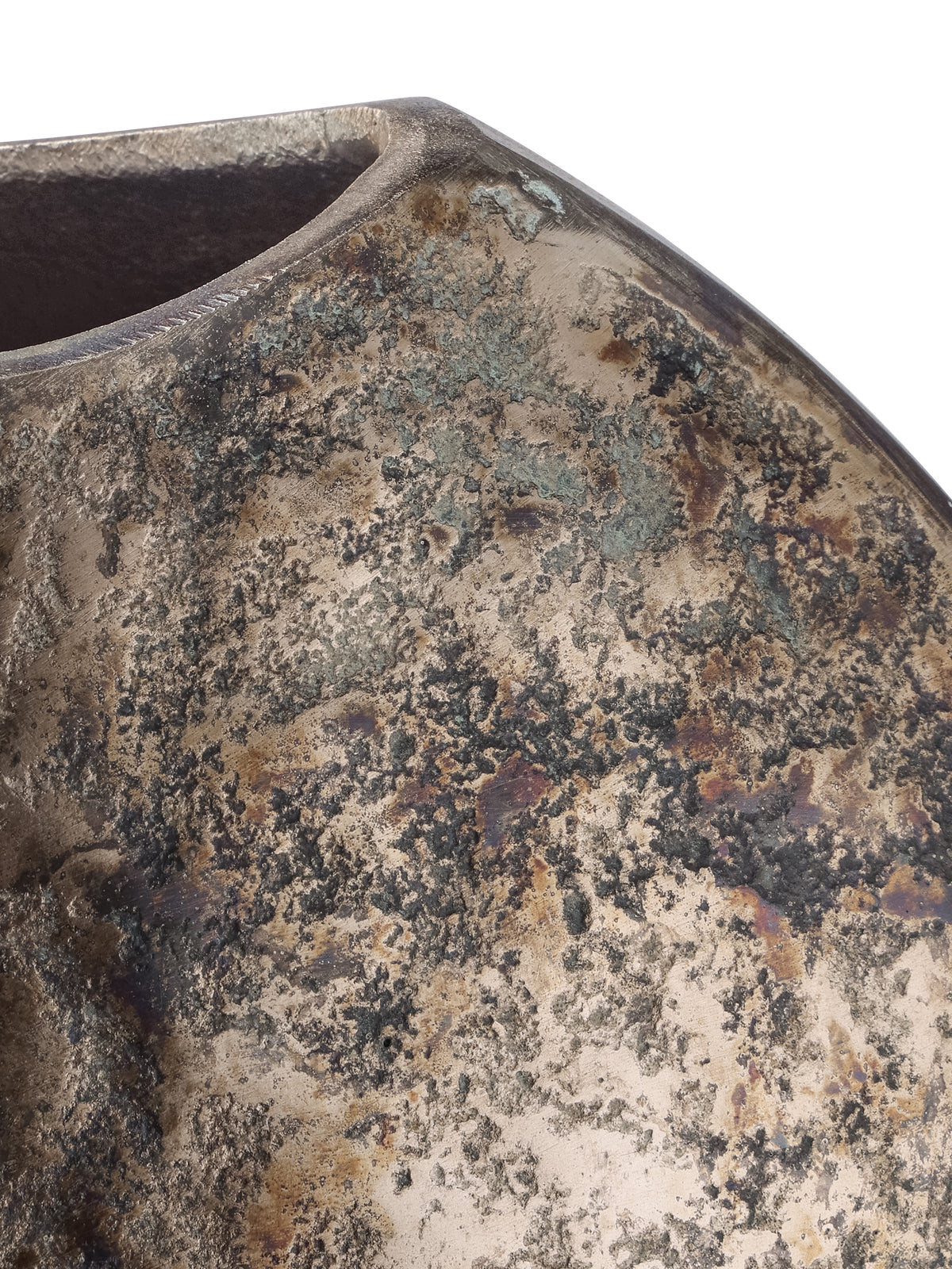 Detail of the vase shoulder and rim, showing bronze tones, dark mottling and verdigris-coloured patches.