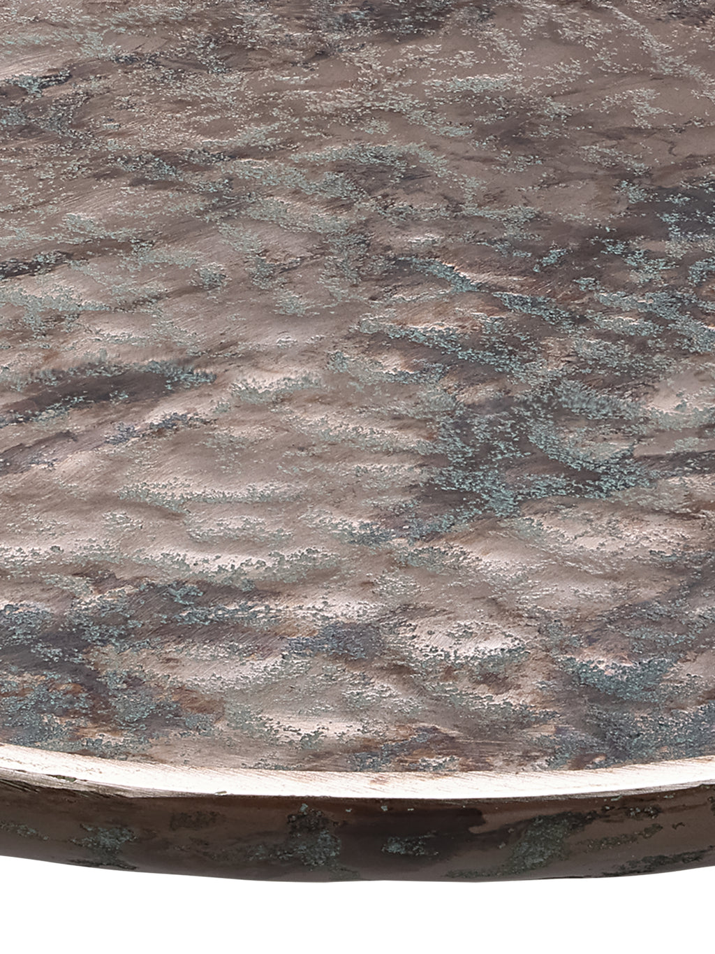 Close-up across the platter's rippled surface, showing fine green mottling and a bright bronze-toned rim.
