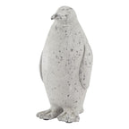 Upright off-white and grey penguin ornament viewed at an angle, showing its rounded body, outlined wings and broad webbed feet.