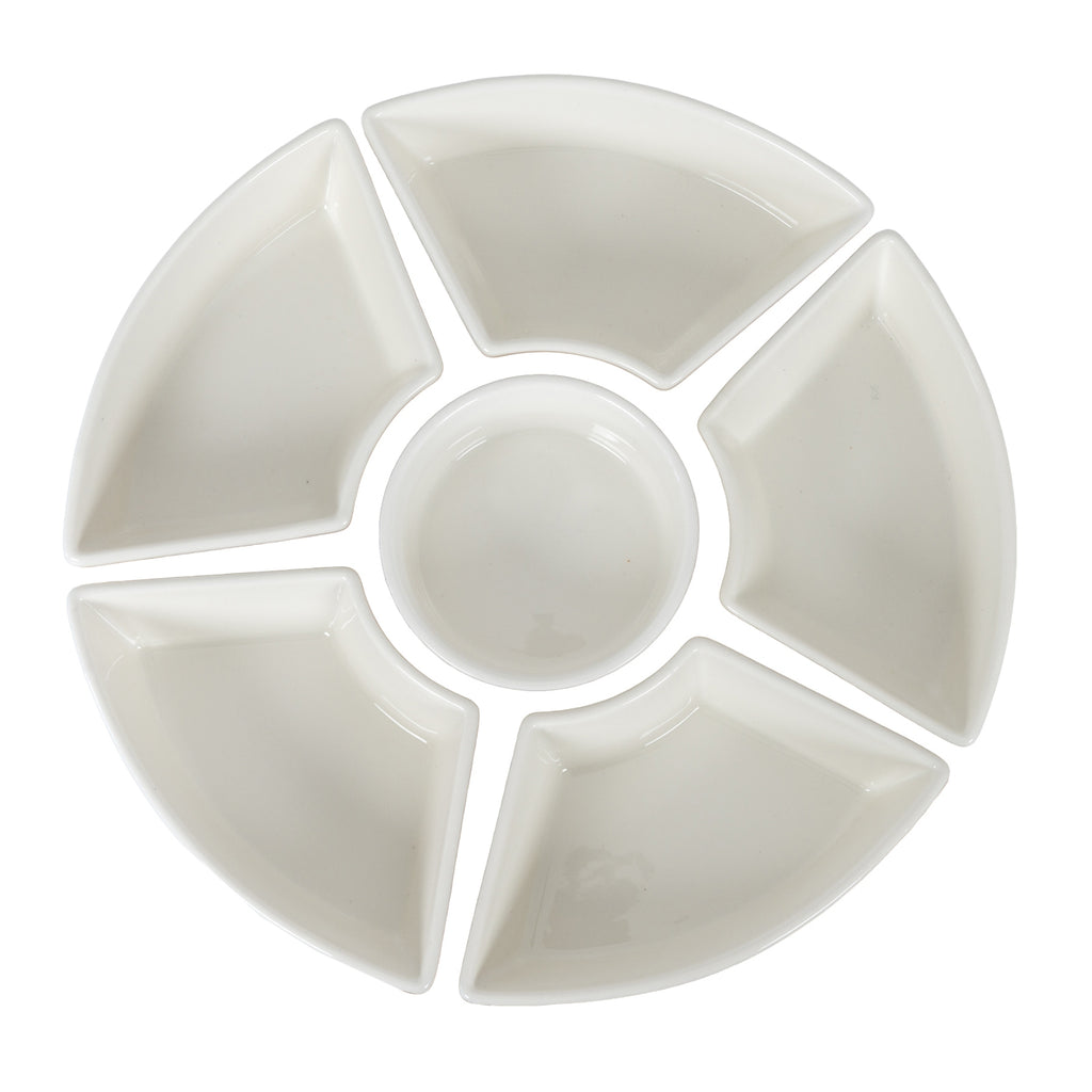Overhead view of five warm-white wedge dishes arranged in a ring around a round bowl on a white background.