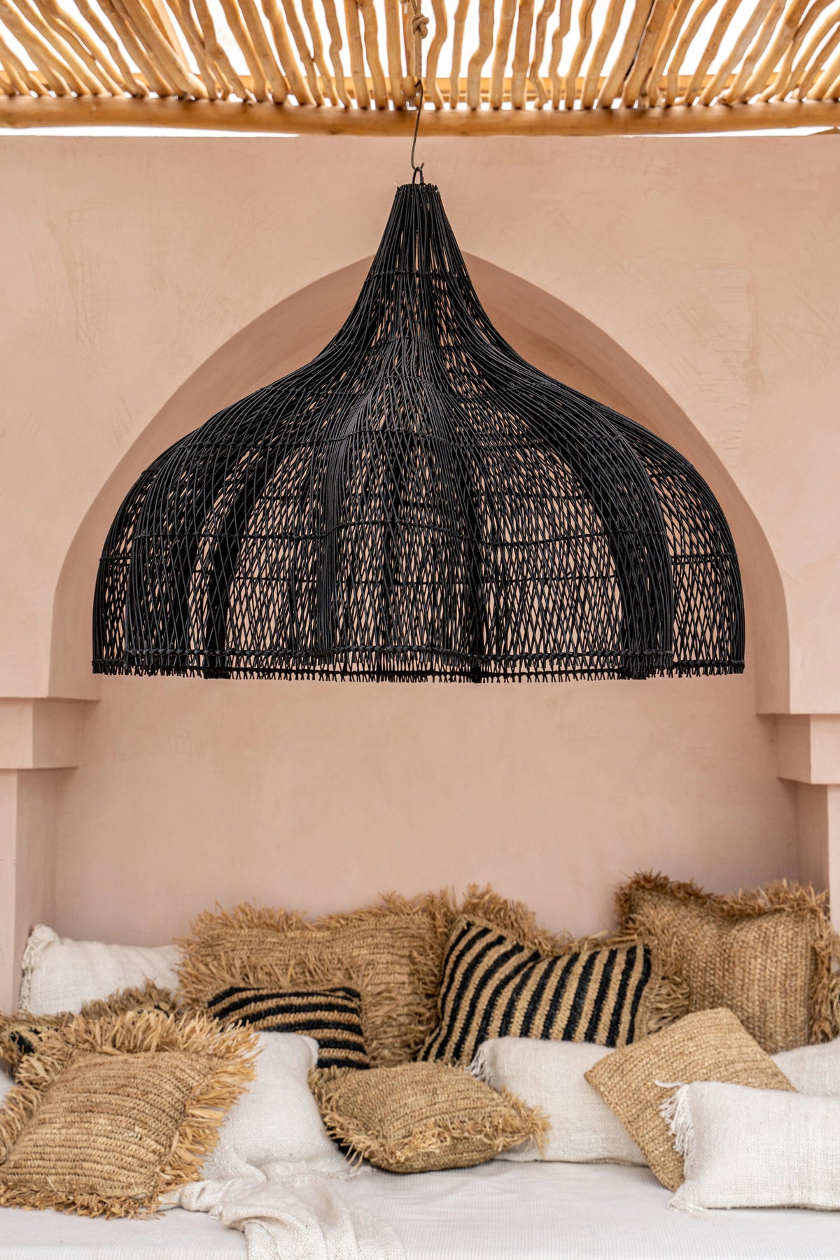 Whipped Rattan Pendant Light – Black, Extra Large – close styled view above a bed