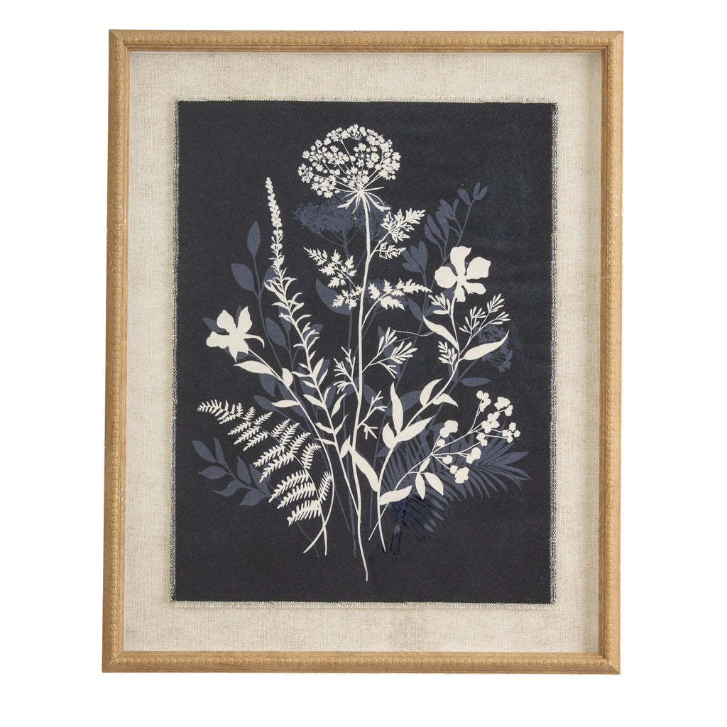 Front view of White Crowncluster Framed Artwork, with white flowers and blue foliage on a dark background inside a pale border and tan-gold frame.