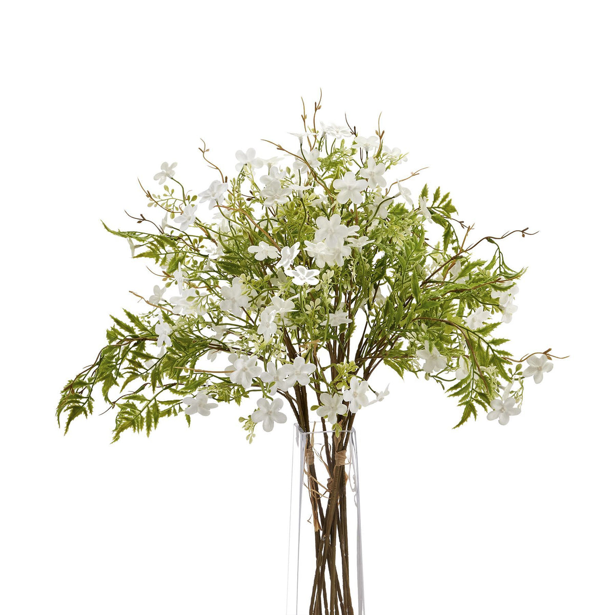 Grouped white artificial flower stems in a tall clear vase, with green foliage spreading across a white background.