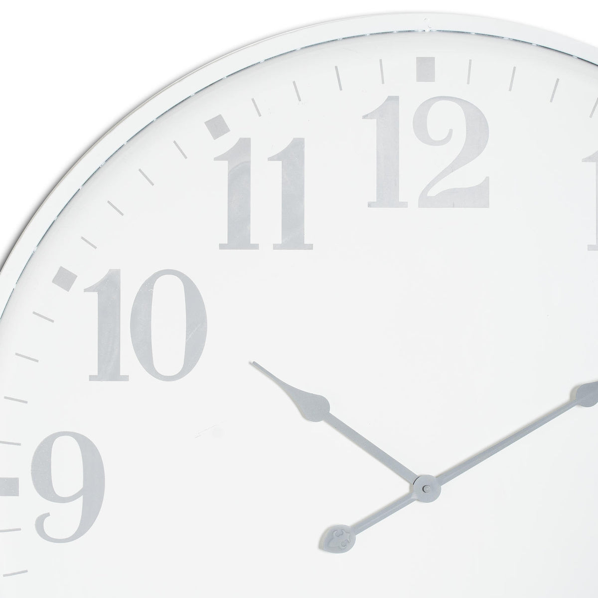 Close-up of the white clock face showing the curved grey numerals, slim rim and shaped hands meeting at the centre.