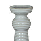 Close-up of the candle holder's broad cup and rounded upper collar, showing horizontal ribs and a faint beige line around the rim.