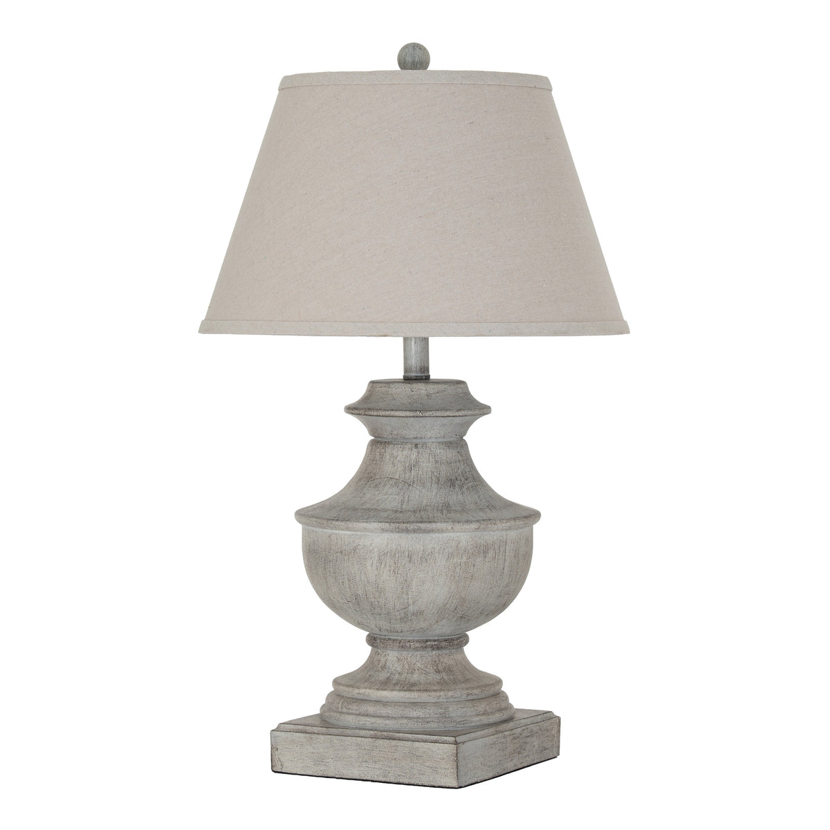 White-grey urn-shaped table lamp on a square plinth, with a pale tapered shade and ball finial against a white background.