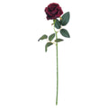 Full view of an artificial wine-burgundy rose on a long green stem with branching dark-green leaves against white.