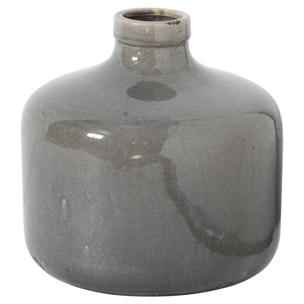Grey ceramic vase on a white background, showing its broad rounded body, short neck, thick rolled rim and dark markings across the crackle glaze.