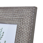 Close-up of the frame's upper right corner, showing the basketweave-like relief, pale highlights and darker side edge.