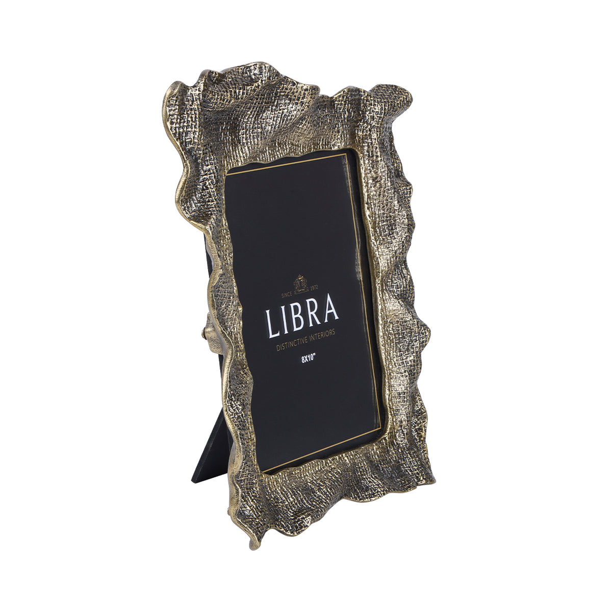 Angled front view of the antique-brass finish photo frame, showing its folded woven border and black easel behind.