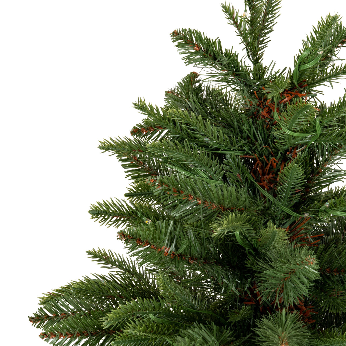 Detail of the artificial tree's upper branches, with mixed green needle textures, brown accents and small clear lamps against a white background.