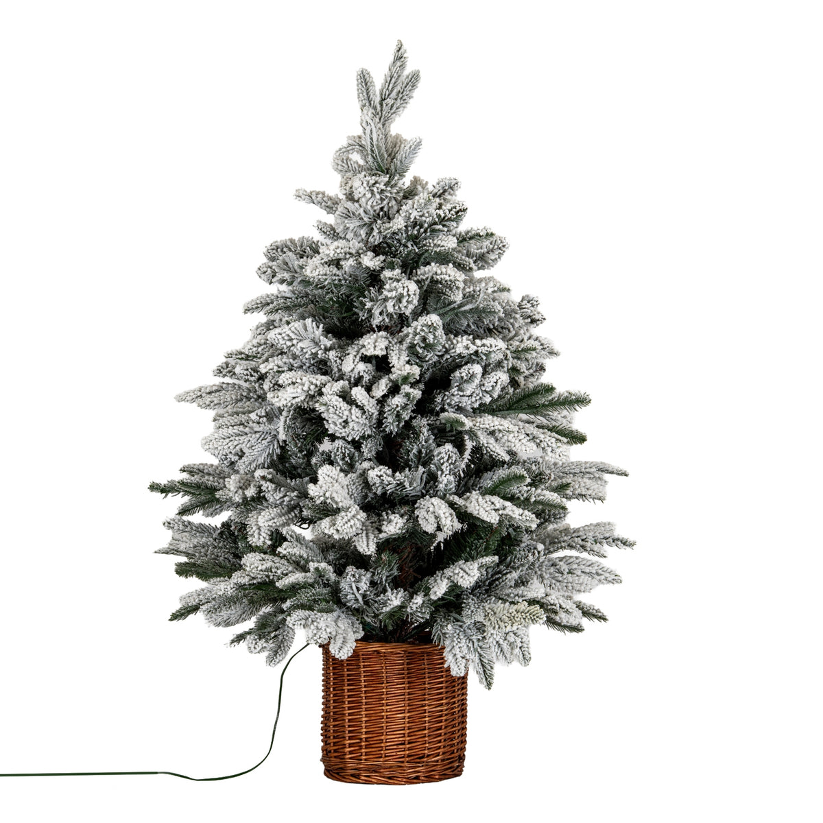 Artificial Christmas tree with an irregular tapered outline, heavily snow-flocked green branches and a tall brown woven pot, with a green lead extending to the left.