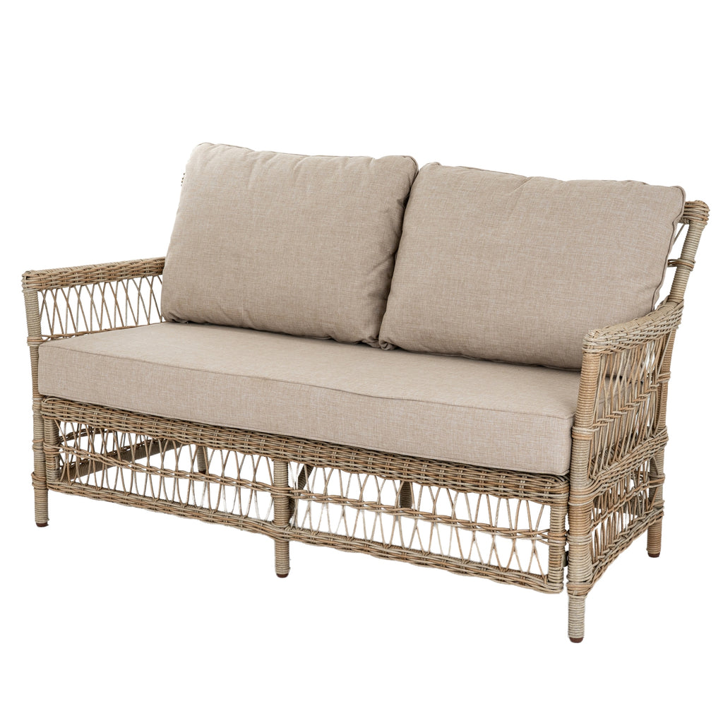 Angled view of the open-lattice sofa with two oatmeal back cushions, a long seat cushion and wrapped arms.