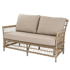 Angled view of the open-lattice sofa with two oatmeal back cushions, a long seat cushion and wrapped arms.