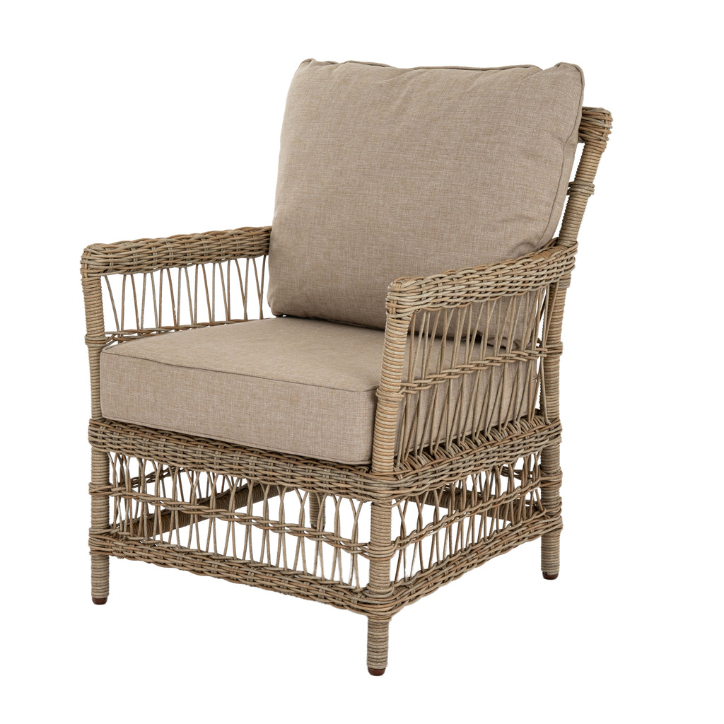 Matching lounge armchair viewed at an angle, showing oatmeal seat and back cushions within a pale open-lattice frame.