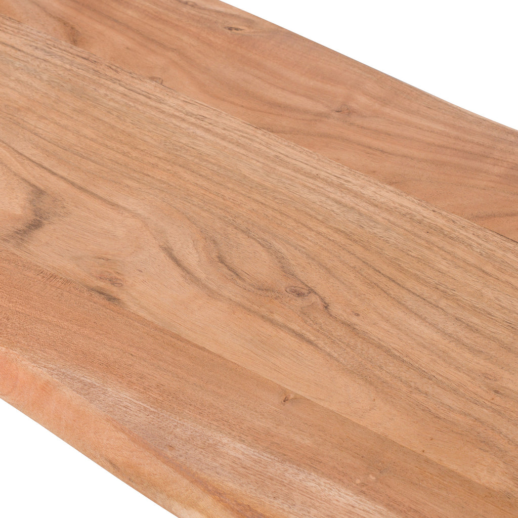 Close-up of the bench seat showing sweeping grain, small knots and variations in the warm-brown surface.