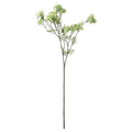 Full view of a yellow-green artificial flower spray with a long green stem, spreading branches, clustered flowers and buds, and sparse fern-like leaves against white.